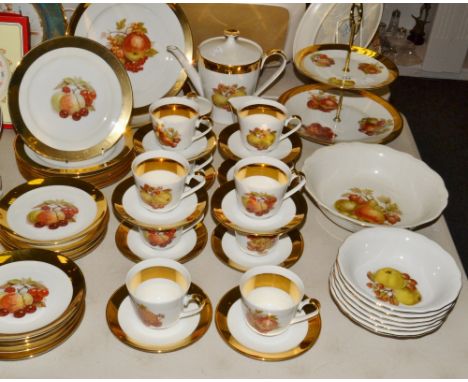 A German tea and dessert service, banded in gold, comprising ten  cups, saucers and side plates one large bowl, six smaller b