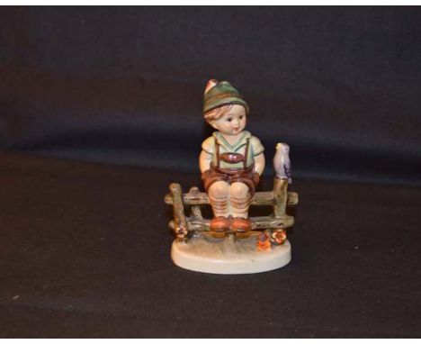 A Hummel Figurine 'Boy on Fence'