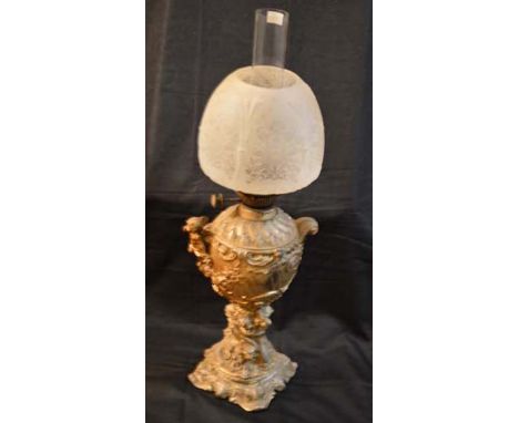 An Unusual and Gilted Metal Figurine Based Oil Lamp Etched Shade 