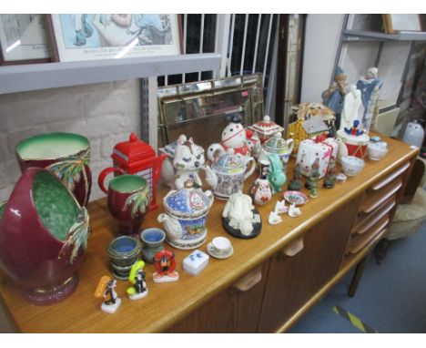 A mixed lot of ceramics to include various novelty teapots, Beswick vases and a basket, Cascades Clown figurine, Davenport Im