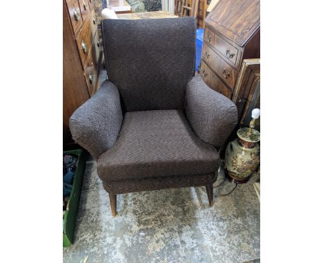 An Ercol armchair reupholstered, on turned legsLocation: 