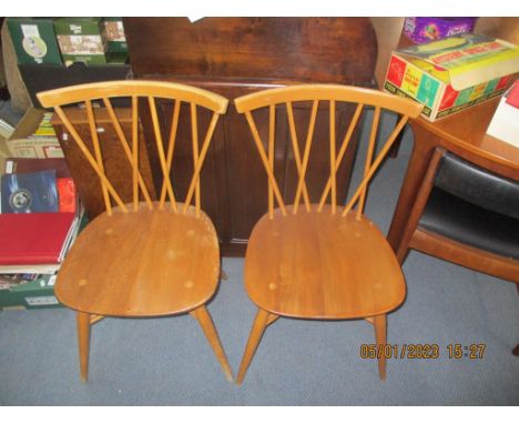 A pair of Ercol beech crossover spindle back chairsLocation: 