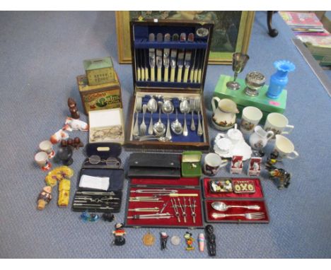 A miscellaneous lot to include Christmas cake decorations, one depicting Felix the Cat, bone dice, cased geometry sets, vinta