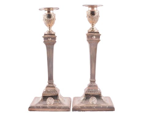 Pair of silver candlesticks, Joseph Tibbitts, Sheffield 1776, urn finials with ribbon swags, fluted square columns, square ba