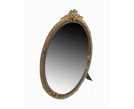 A 19th century French gilt brass and paste set mirror, bevelled oval form, tooled and chased with ribbon and floral boughs, b