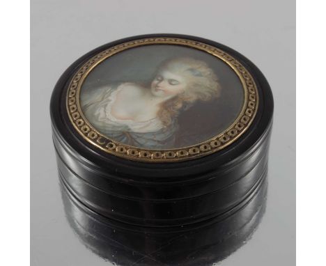 An 18th century French gilt metal mounted tortoiseshell snuff box, the lid with a glazed portrait of a woman, 7.5cm diameter