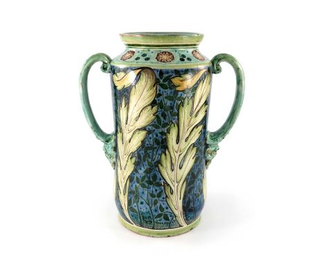 Cassandra Annie Walker for Della Robbia, an art pottery twin handled vase, 1905, cylindrical albarello form, painted with lea