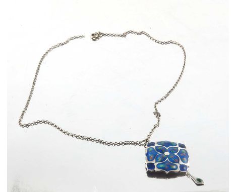 An Arts and Crafts silver and enamelled pendant, Smith and Ewen, Birmingham 1909, in the form of an ogee petal flower, with g