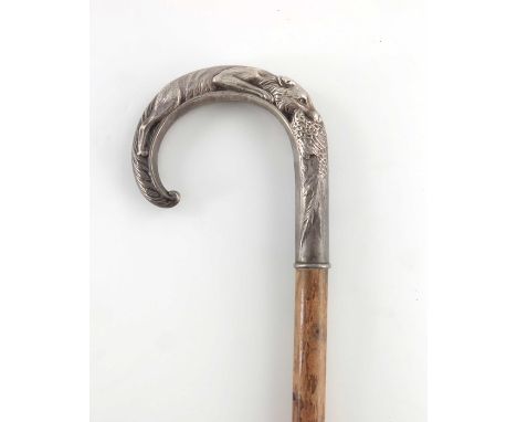 An Elizabeth II silver handled walking stick, W I Broadway and Co., London 1985, the crook end relief moulded as a fox eating