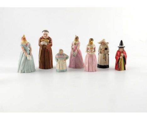 A collection of Royal Worcester candle snuffers, including Jenny Lind, monk etc. (9)