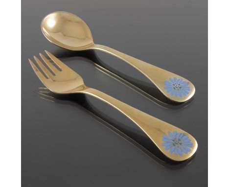 Georg Jensen, a Modernist silver gilt and enamelled spoon and fork set, Denmark 1980, each with champleve enamel daisies to t