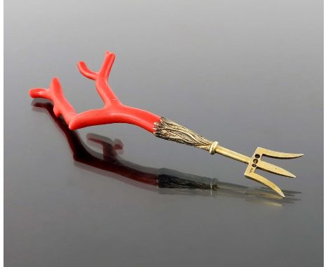 An early Victorian silver gilt and coral fork, William Fountain, London 1839, the nautical trident tines emanating from a cas