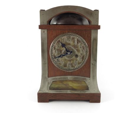 Hamburg American Clock Company, a Jugendstil oak bracket clock, of tapered plinth form with silvered strap decoration, the 6 