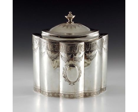 A George III silver tea caddy, Henry Chawner, London 1797, straight sided lobed or reeded oval form, bright cut decorated wit