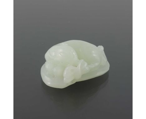 A Chinese jade carving, modelled as a leopard and butterfly on a leaf, 4.5cm long