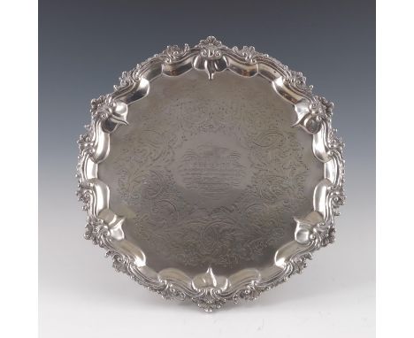 A Victorian silver salver, Joseph and Albert Savory, London 1851, circular form, cast with foliate scroll ogee border, etched