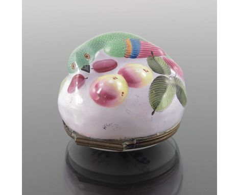An 18th century Bilston enamel snuff box, modelled in relief with a parrot and fruit, the lid painted with floral sprigs, 4.5