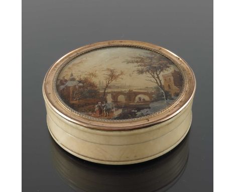 An 18th century gilt metal mounted ivory and tortoiseshell snuff box, the lid glazed and painted with a Romantic landscape af