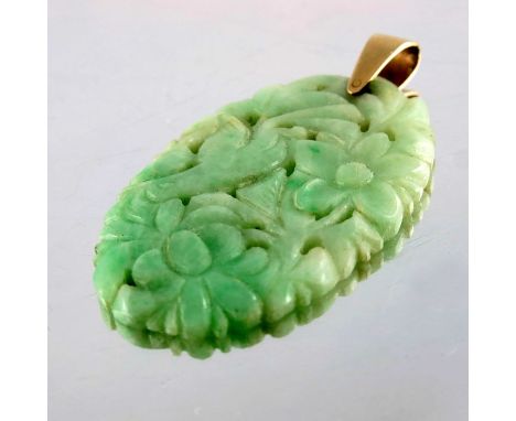 A Chinese carved and reticulated jade pendant, on gold suspension, oval form with bird and flowers, 4.5cm long