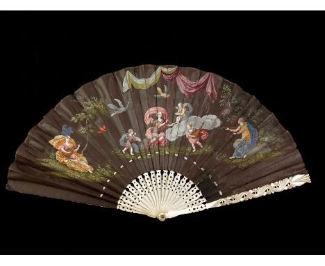 λ A mid 17th century large ivory and vellum European fan painted with various musicians in a landscape, along with exotic fly