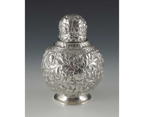 A Victorian silver tea caddy, Horace Woodward and Co., London 1891, footed spherical form with domed lid, heavily embossed an