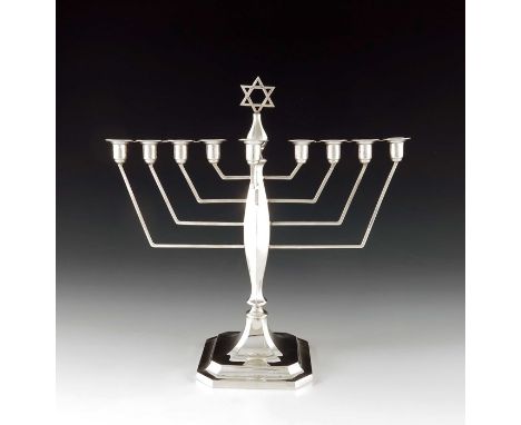 An Elizabeth II silver Hanukiah, Alexander Smith, Birmingham 1956, traditional eight branch form, on square base and octagona