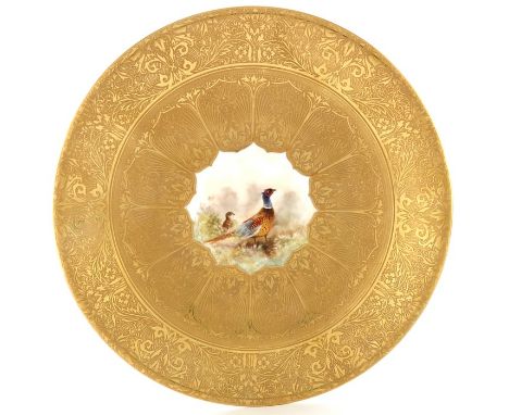 David A Whatmore for Royal Worcester, a pheasant painted gilt cabinet plate, within a heavily tooled and gilded ground of fol