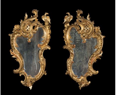 Pair of Rococo cornucopias; Spain, early 20th century.Carved and gilded wood.Measurements: 72 x 39 cm (x2).The cornucopias we