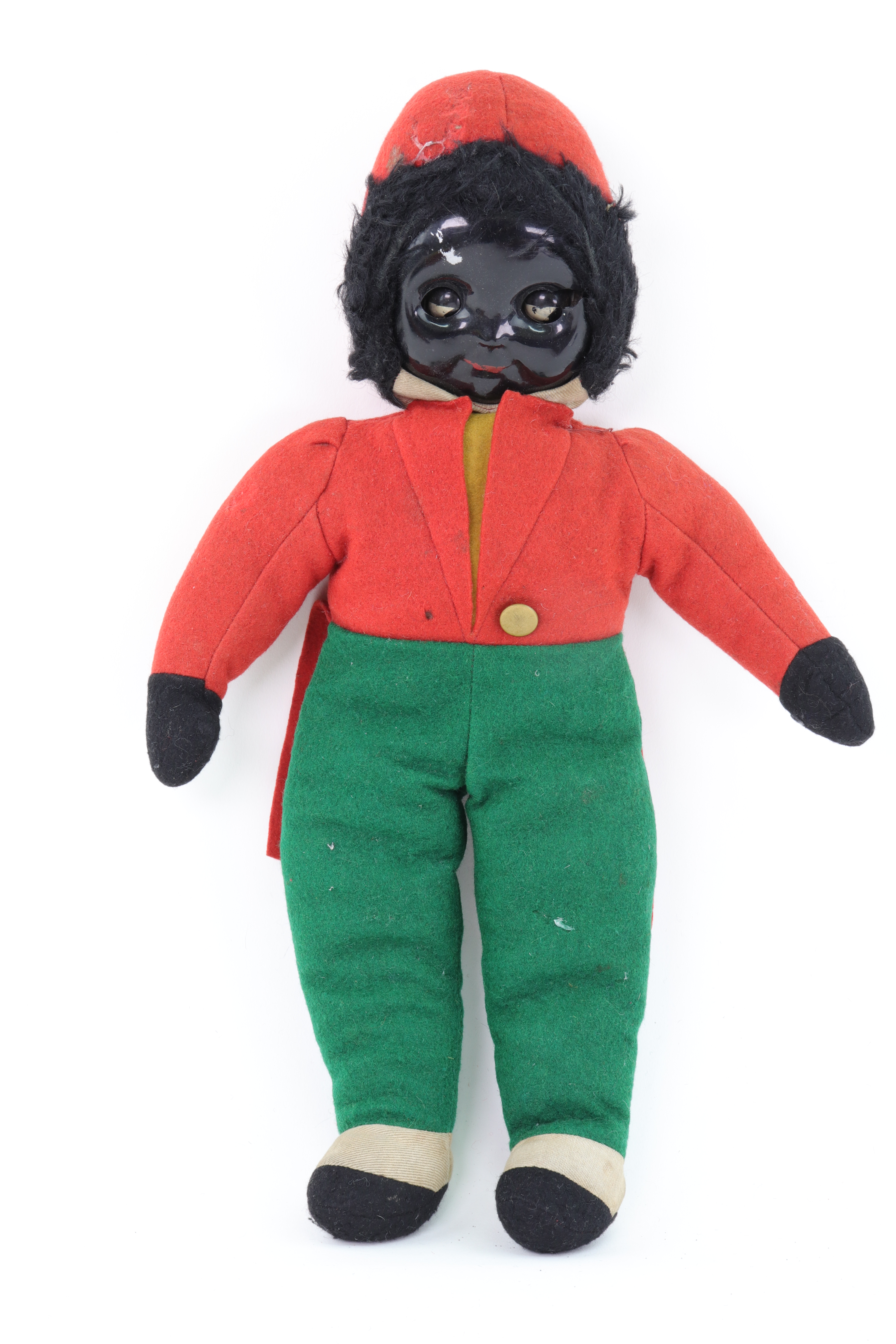 A vintage Golliwogg doll circa 1920's, painted pressed celluloid face ...