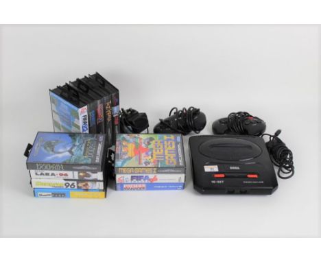 A Sega 16-Bit Megadrive II games console, together with two controllers, a mains adapter, and 12 games, to include Fifa 95 an