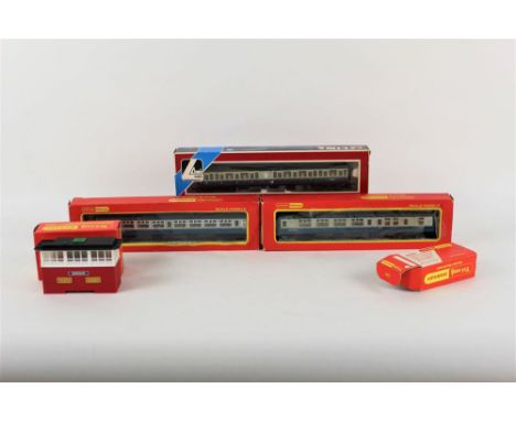 A group of boxed Lima, Hornby, and Tri-ang Hornby 00 gauge model coaches and a signal box 