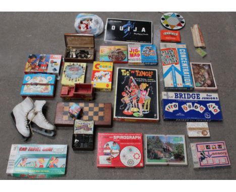 A box of various vintage board games, including Cootie, Tie 'n' Tangle, dominoes, Concentration, and a Merit solitaire game, 