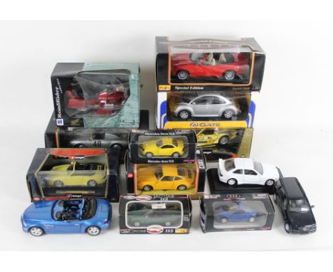 A group of large scale and other diecast, to include Burago 1/18 scale, Newray, and Gate, models including a Gold Collection 