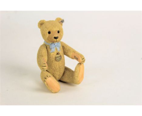 A Steiff porcelain teddy bear, commemorating the year of 1949, and having jointed limbs