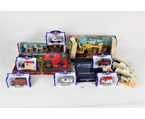 A group of boxed diecast, to include a Britain's JCB excavator, a Lledo Days Gone Pickfords set, a Corgi 1902 State Landau, L