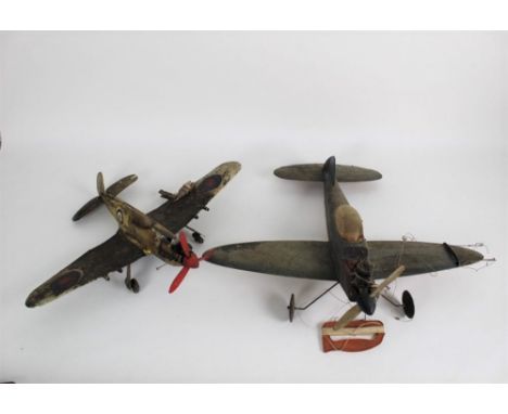 Two vintage motorised spitfire plane models on string, the largest measuring 46 cm long, and fitted with motors 