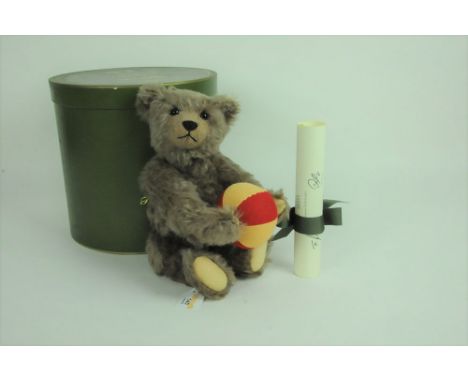 A Steiff Harrod's limited edition teddy bear, "Archie The Attic bear", 377 of 1500, having a caramel mohair covered body, car