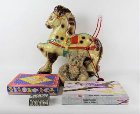 A mid century Mobo tinplate push along horse, measuring 53 cm tall, together with a Steiff Zotty teddy bear, having non-funct