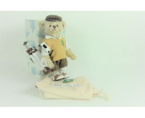 A Steiff limited edition teddy bear, Golf Player, 1096 of 3000, having a blonde mohair covered body, wearing a yellow knitted