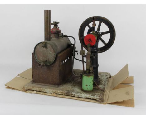 A large metal stationary engine, having copper cylinder boiler, and measuring 40 cm tall, 40 cm wide and 34 cm deep