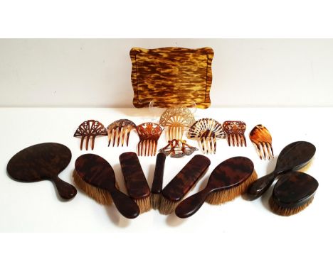 SELECTION OF VINTAGE TORTOISESHELL EFFECT DRESSING TABLE ITEMScomprising a set of five brushes, a hand mirror, two further br