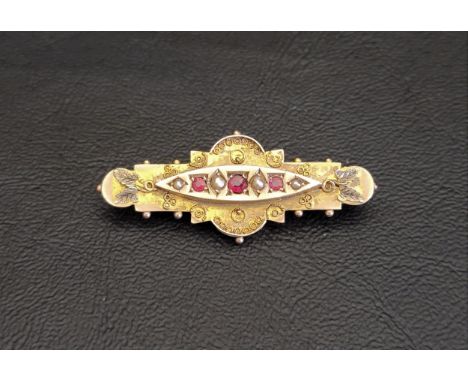 VICTORIAN RUBY AND SEED PEARL BROOCHin nine carat gold, with rope twist scroll decoration, 4.3cm long and approximately 3.2 g
