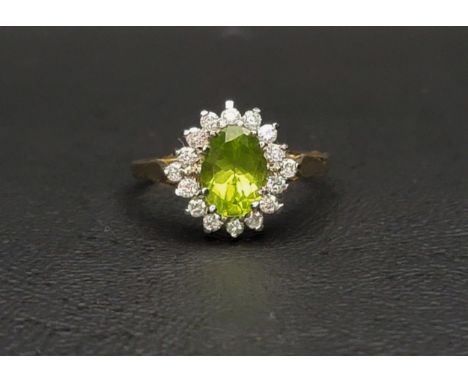 PERIDOT AND DIMAOND CLUSTER RINGthe central oval cut peridot measuring approximately 1ct, in a sixteen diamond surround, on a