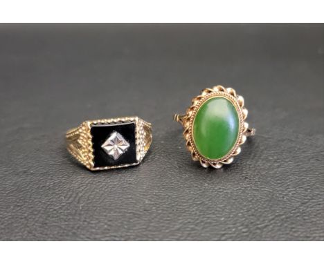 TWO NINE CARAT GOLD DRESS RINGSone with black enamel panel set with central diamond, the other with oval cabochon jade colour