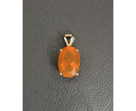 ATTRACTIVE FIRE OPAL PENDANTthe oval cut fire opal measuring approximately 14.2mm x 9.6mm x 6.7mm in ten carat gold mount 