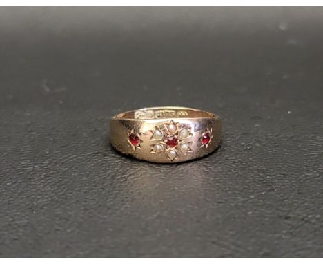 RUBY AND SEED PEARL SET RINGin nine carat gold, ring size M and approximately 1.5 grams 