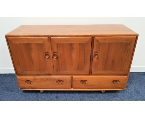 ERCOL MID CENTURY ELM 'WINDSOR' SIDEBOARDmodel 468, with three cupboard doors above two drawers below, with internal cutlery 