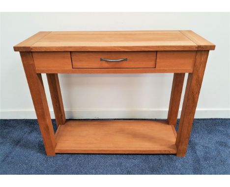 NEXT OAK HALL TABLEthe rectangular top above a central frieze drawer with a shelf below, standing on plain supports, 80.5cm x