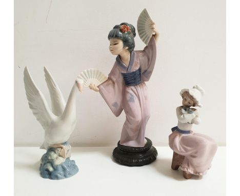 LLADRO GEISHA FIGURINE AND TWO NAO FIGURINESthe geisha with two fans and flowers in her hair, 30.5cm high; the Nao figurines 