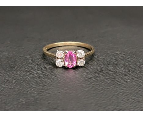 PINK TOPAZ AND DIAMON CLUSTER RINGthe central oval cut pink topaz flanked by two round cut diamonds on either side, on a nine